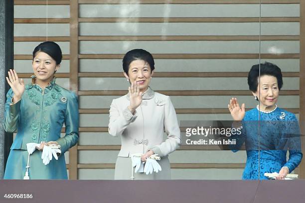Princess Tsuguko, Princess Hisako of Takamado and Princess Hanako of Hitachi wave to well-wishers during the celebration for the New Year on the...