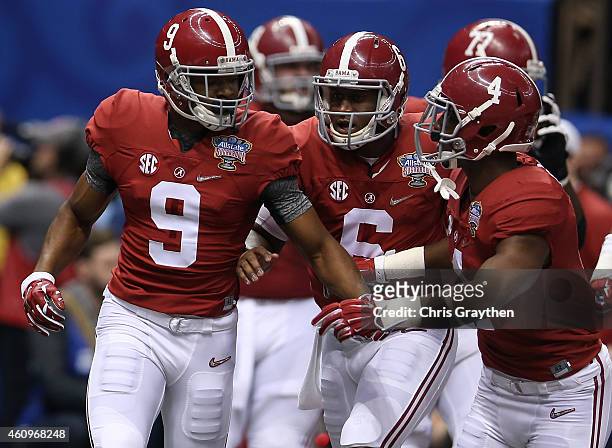 Amari Cooper and Blake Sims of the Alabama Crimson Tide celebrate with their teammates after scoring touchdown in the first quarter against the Ohio...