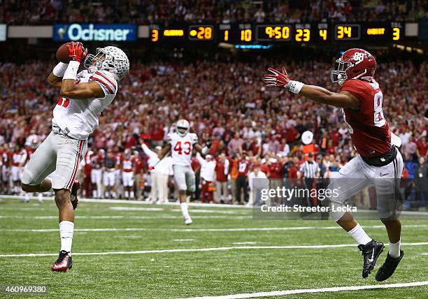 Vonn Bell of the Ohio State Buckeyes intercepts a ball in the fourth quarter thrown by Blake Sims of the Alabama Crimson Tide during the All State...