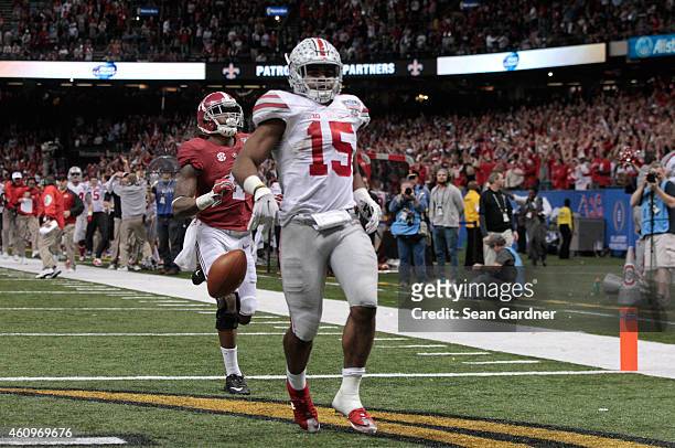 Ezekiel Elliott of the Ohio State Buckeyes celebrates after scoring a touchdown in the fourth quarter against the Alabama Crimson Tide during the All...