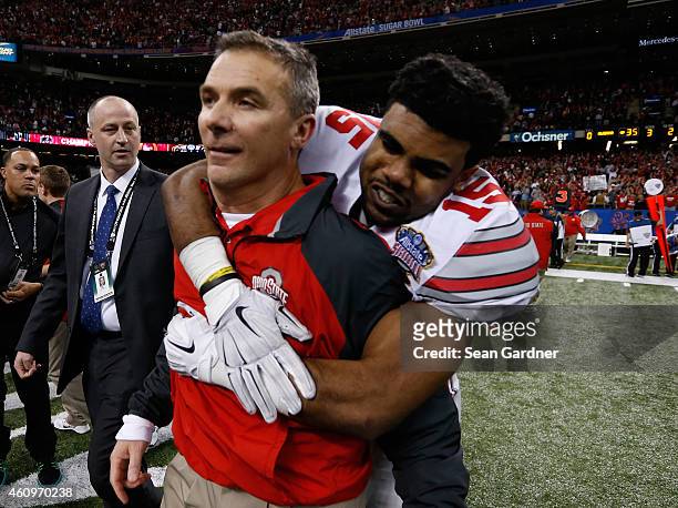 Head coach Urban Meyer of the Ohio State Buckeyes celebrates with Ezekiel Elliott after defeating the Alabama Crimson Tide in the All State Sugar...
