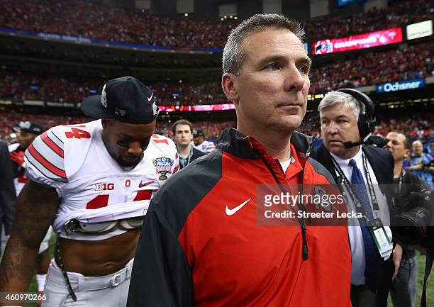 Head coach Urban Meyer of the Ohio State Buckeyes celebrates after defeating the Alabama Crimson Tide in the All State Sugar Bowl at the...