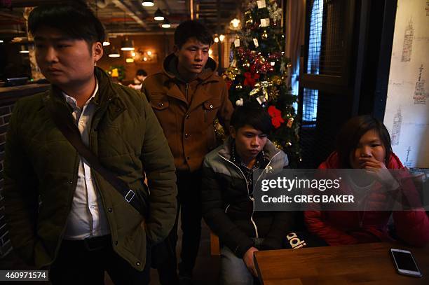 Relatives of victims of the New Year's Eve stampede gather in Shanghai on January 2, 2015. The New Year's stampede just before midnight on Shanghai's...