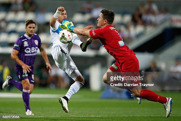 Danny Vukovic of Perth Glory stops a Kosta Barbarouses of Melbourne Victory shot at goal during the round 14 A-League match between the Melbourne...