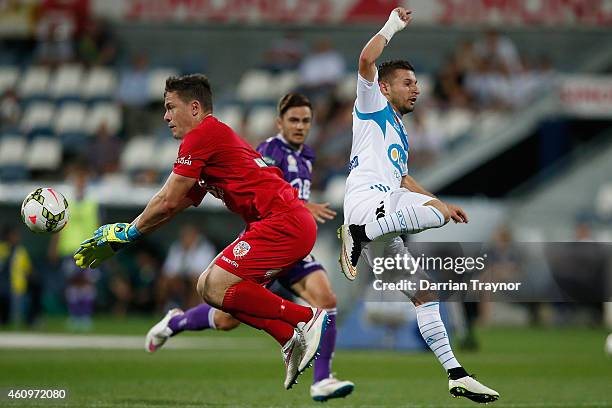 Danny Vukovic of Perth Glory stops a Kosta Barbarouses of Melbourne Victory shot at goal during the round 14 A-League match between the Melbourne...