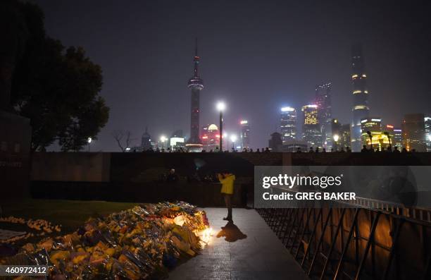 Man offers prayers at the site of the New Year's Eve stampede in Shanghai on January 2, 2015. The New Year's stampede just before midnight on...