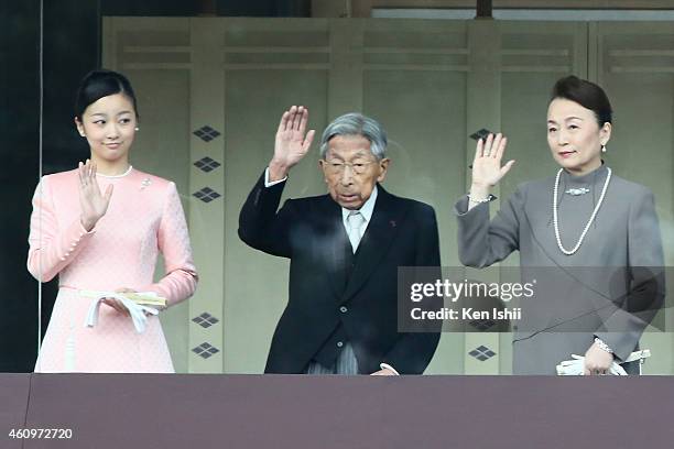 Princess Kako of Akishino, Prince Mikasa and Princess Tomohito of Mikasa wave to well-wishers during the celebration for the New Year on the veranda...