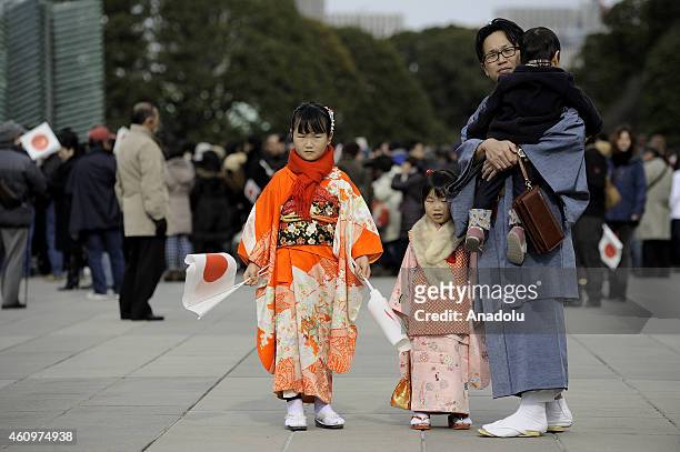 Father with his kids visit the Imperial Palace which was opened for the New Year's public appearance by the Japanese royal family, in Tokyo, Japan on...