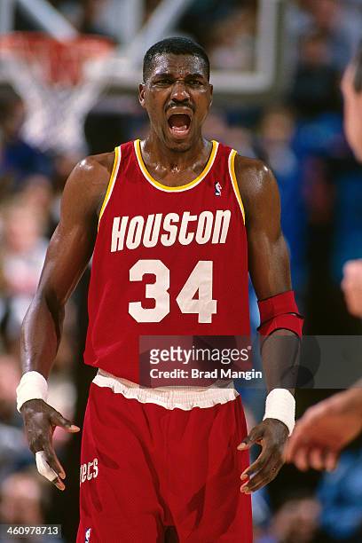 Hakeem Olajuwon of the Houston Rockets reacts during a game played circa 1995 at Arco Arena in Sacramento, California. NOTE TO USER: User expressly...