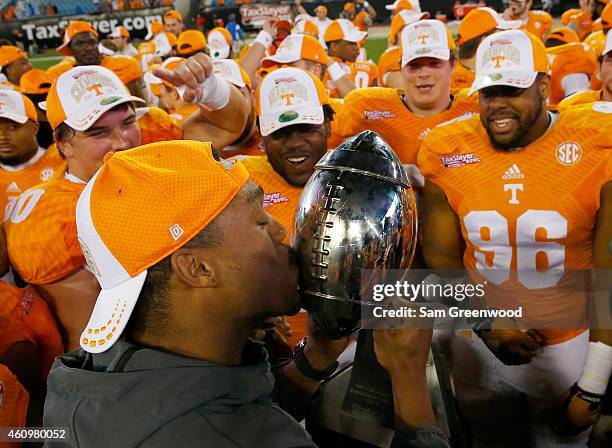 Tennessee Volunteers players celebrate following the TaxSlayer Bowl against the Iowa Hawkeyes at EverBank Field on January 2, 2015 in Jacksonville,...