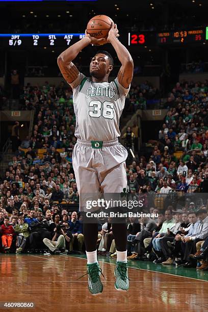 Marcus Smart of the Boston Celtics takes a shot against the Dallas Mavericks on January 2, 2015 at the TD Garden in Boston, Massachusetts. NOTE TO...