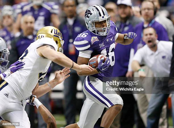 Kansas State wide receiver Tyler Lockett makes a punt return in the second quarter, setting up a field goal, against UCLA in the Valero Alamo Bowl at...