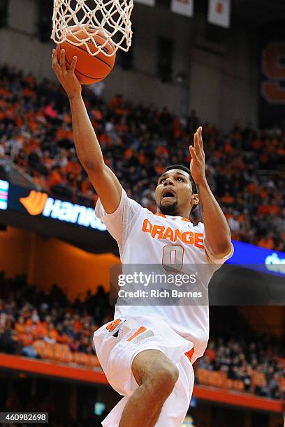 Michael Gbinije of the Syracuse Orange shoots the ball against the Long Beach State 49ers during the second half at the Carrier Dome on December 28,...