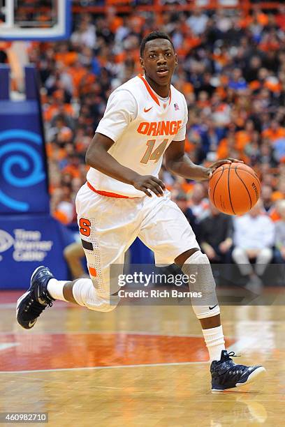 Kaleb Joseph of the Syracuse Orange dribbles the ball up the court against the Long Beach State 49ers during the second half at the Carrier Dome on...