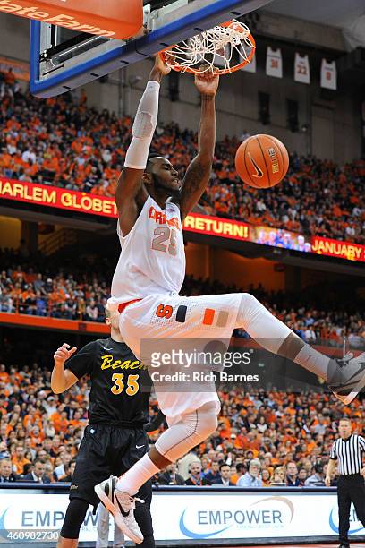 Rakeem Christmas of the Syracuse Orange dunks the ball against the Long Beach State 49ers during the second half at the Carrier Dome on December 28,...
