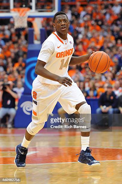 Kaleb Joseph of the Syracuse Orange dribbles the ball up the court against the Long Beach State 49ers during the second half at the Carrier Dome on...