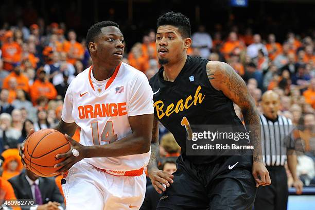 Kaleb Joseph of the Syracuse Orange drives to the basket past Tyler Lamb of the Long Beach State 49ers during the second half at the Carrier Dome on...