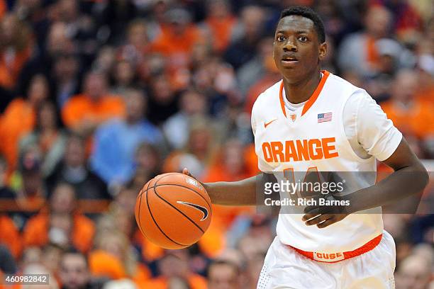 Kaleb Joseph of the Syracuse Orange dribbles the ball up the court against the Long Beach State 49ers during the second half at the Carrier Dome on...