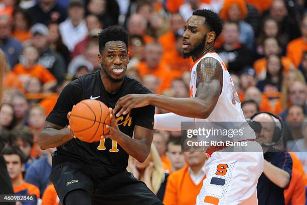 David Samuels of the Long Beach State 49ers looks to pass the ball around Rakeem Christmas of the Syracuse Orange during the second half at the...