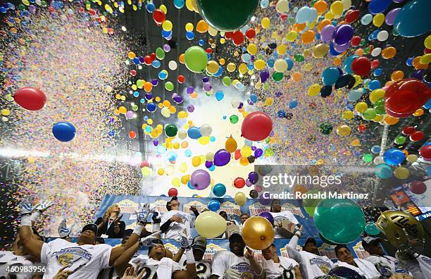 The UCLA Bruins celebrate their 40-35 win against the Kansas State Wildcats during the Valero Alamo Bowl at Alamodome on January 2, 2015 in San...