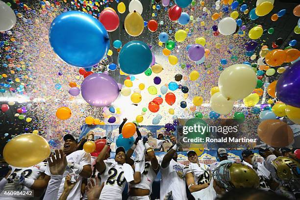 The UCLA Bruins celebrate their 40-35 win against the Kansas State Wildcats during the Valero Alamo Bowl at Alamodome on January 2, 2015 in San...