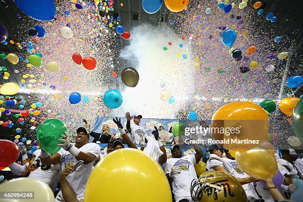 The UCLA Bruins celebrate their 40-35 win against the Kansas State Wildcats during the Valero Alamo Bowl at Alamodome on January 2, 2015 in San...