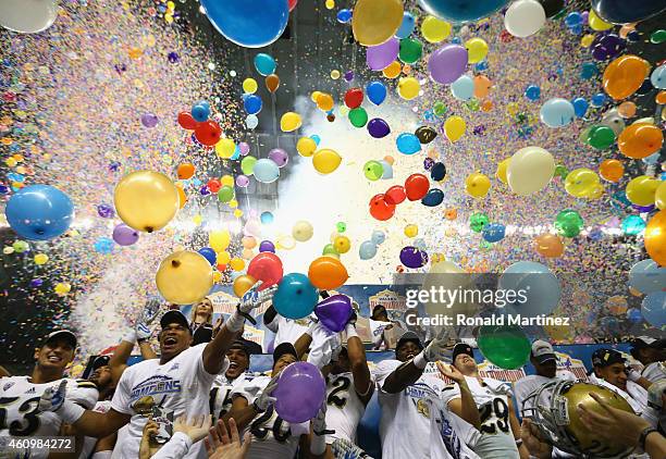 The UCLA Bruins celebrate their 40-35 win against the Kansas State Wildcats during the Valero Alamo Bowl at Alamodome on January 2, 2015 in San...