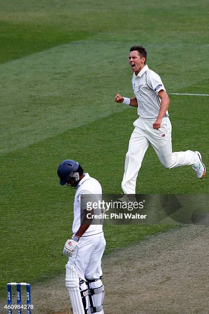 Trent Boult of New Zealand celebrates his wicket of Dimuth Karunaratne of Sri Lanka during day one of the Second Test match between New Zealand and...