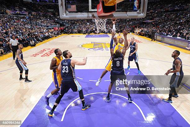 Kobe Bryant of the Los Angeles Lakers goes to the basket against Quincy Pondexter of the Memphis Grizzlies on January 2, 2015 at Staples Center in...