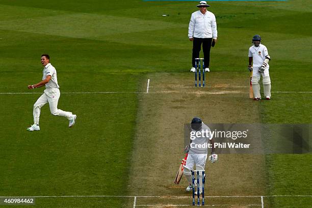 Trent Boult of New Zealand celebrates his wicket of Dimuth Karunaratne of Sri Lanka during day one of the Second Test match between New Zealand and...