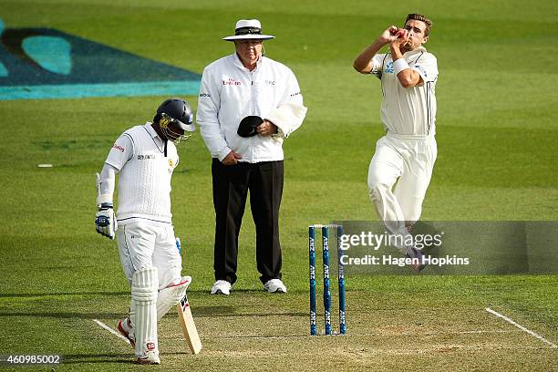 Tim Southee of New Zealand bowls while Kumar Sangakkara of Sri Lanka looks on during day one of the Second Test match between New Zealand and Sri...