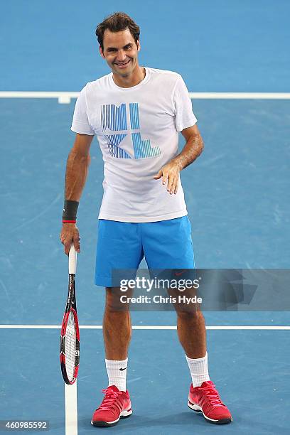 Roger Federer smiles during a practise session ahead of the 2015 Brisbane International at Queensland Tennis Centre on January 3, 2015 in Brisbane,...