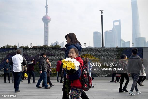 Family prepare to pray for victims at the site of the New Year's Eve stampede in Shanghai on January 3, 2015. The New Year's stampede just before...