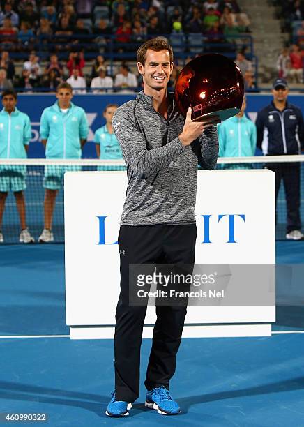 Andy Murray of Great Britain poses with the trophy after winning the the Mubadala World Tennis Championship at Zayed Sport City on January 3, 2015 in...