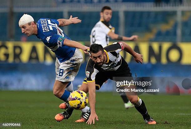 Giampiero Pinzi of Udinese Calcio is pulled by his shirt by Daniele Gastaldello of UC Sampdoria during the Serie A match betweeen UC Sampdoria and...