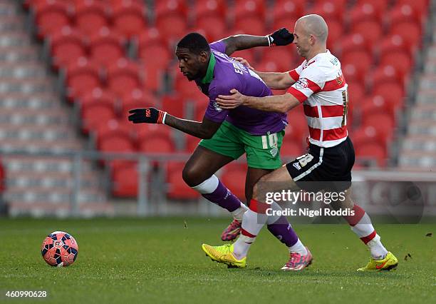 Paul Keegan of Doncaster Rovers challenges Jay Emmanuel-Thomas of Bristol City during the FA Cup Third Round match between Doncaster Rovers and...