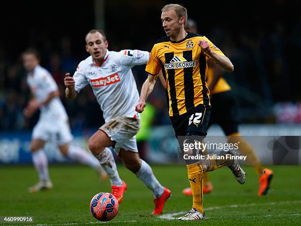 Luke Chadwick of Cambridge moves away from Jake Howells of Luton during the FA Cup Third Round match between Cambridge United and Luton Town at the...