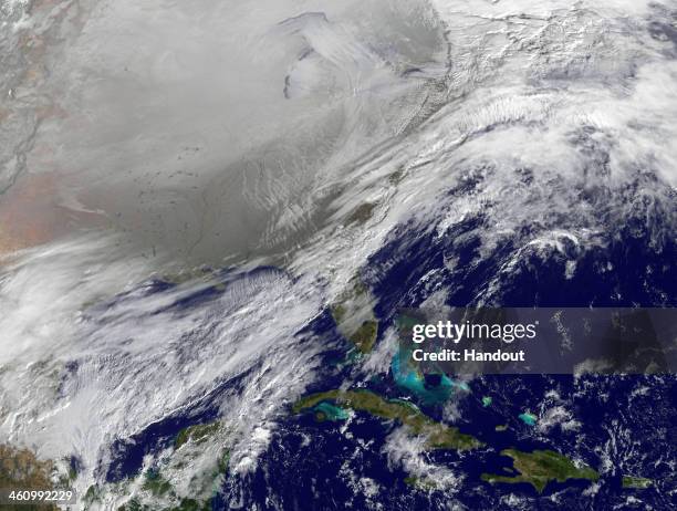 In this satellite handout image provided by National Oceanic and Atmospheric Administration , shows the entry of a large area of low pressure, from...