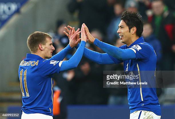 Leonardo Ulloa of Leicester City celebrates scoring the opening goal with Marc Albrighton of Leicester City during the FA Cup Third Round match...