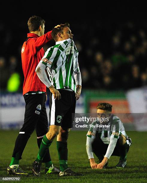 Blyth player Stephen Turnball is consoled as Jarrett Rivers looks on after the FA Cup Third Round match between Blyth Spartans and Birmingham City at...