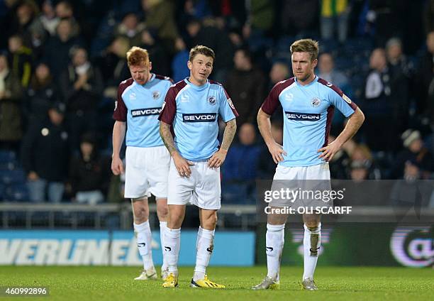 Gateshead's Welsh midfielder John Oster and teammates react after conceding their sixth goal during the English FA Cup third round football match...