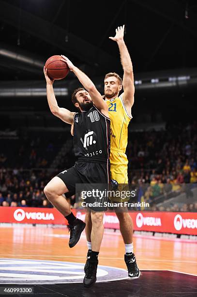 Tim Abromaitis of Braunschweig challenges Bastian Doreth of Artland during the Bundesliga basketball game between Basketball Loewen Braunschweig and...