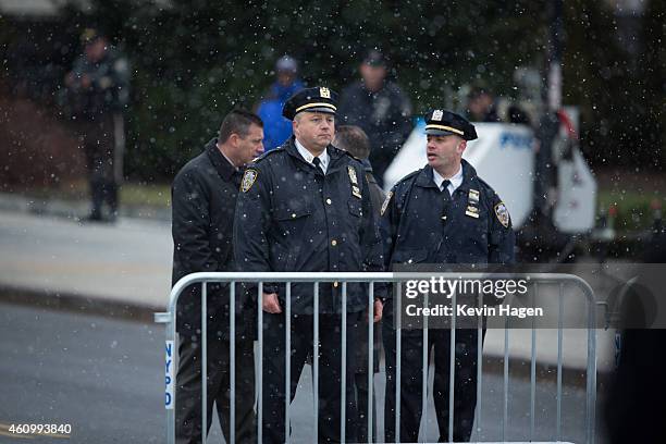 Officers kept watch in front of the viewing for Police Officer Wenjian Liu at Aievoli Funeral Home in the neighborhood of Dyker Heights on January 3,...