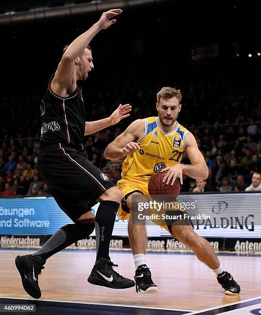 Tim Abromaitis of Braunschweig is challenged during the Bundesliga basketball game between Basketball Loewen Braunschweig and Artland Dragons on...