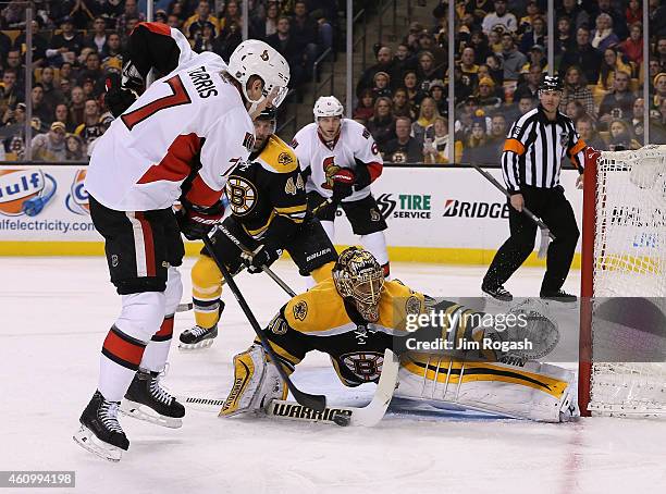 Kyle Turris of the Ottawa Senators shoots on net as Tuukka Rask of the Boston Bruins defends in the second period at TD Garden on January 3, 2015 in...