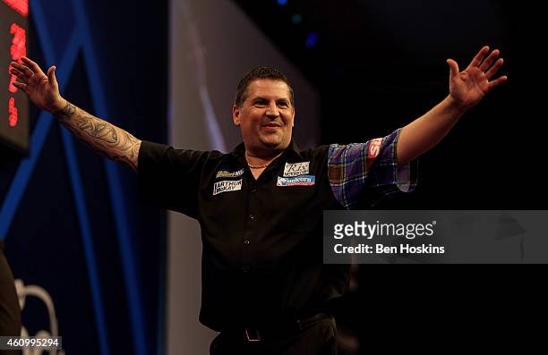 Gary Anderson of Scotland celebrates winning his semi final match against Michael van Gerwen of the Netherlands on day thirteen of the 2015 William...