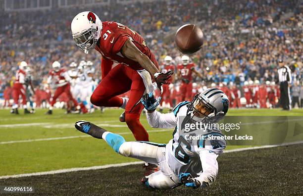 Philly Brown of the Carolina Panthers attempts to catch a pass while being guarded by Antonio Cromartie of the Arizona Cardinals during their NFC...