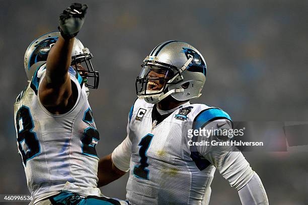 Cam Newton and Jonathan Stewart of the Carolina Panthers celebrate during their NFC Wild Card Playoff game against the Arizona Cardinals at Bank of...