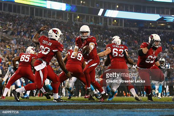 Ryan Lindley of the Arizona Cardinals fakes the hand off to Stepfan Taylor out of their own endzone in the 2nd quarter against the Carolina Panthers...