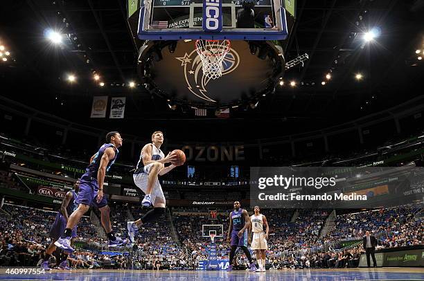 Luke Ridnour of the Orlando Magic goes to the basket against the Charlotte Hornets on January 3, 2015 at Amway Center in Orlando, Florida. NOTE TO...